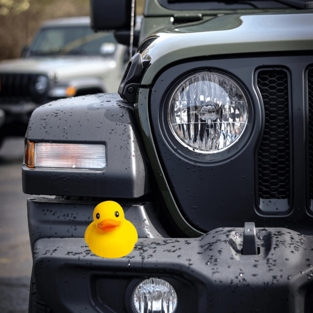 Rubber duck sitting on Front Pumber of Jeep