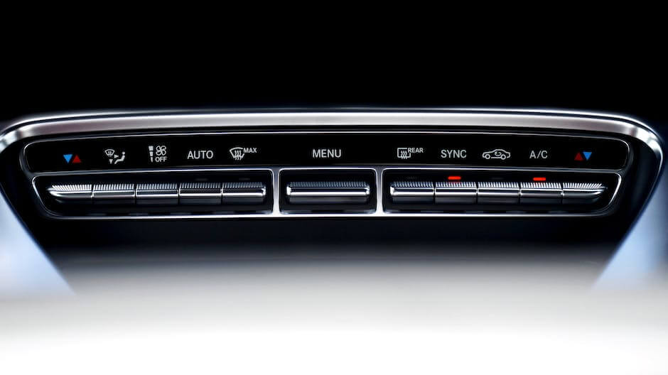 A close-up image of a car's throttle system with electronic components connected to it, symbolizing the technological nature of electronic throttle control systems.