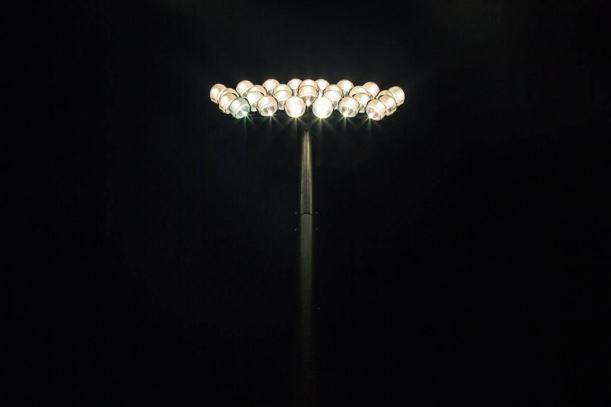 An image of a floodlight illuminating a football stadium