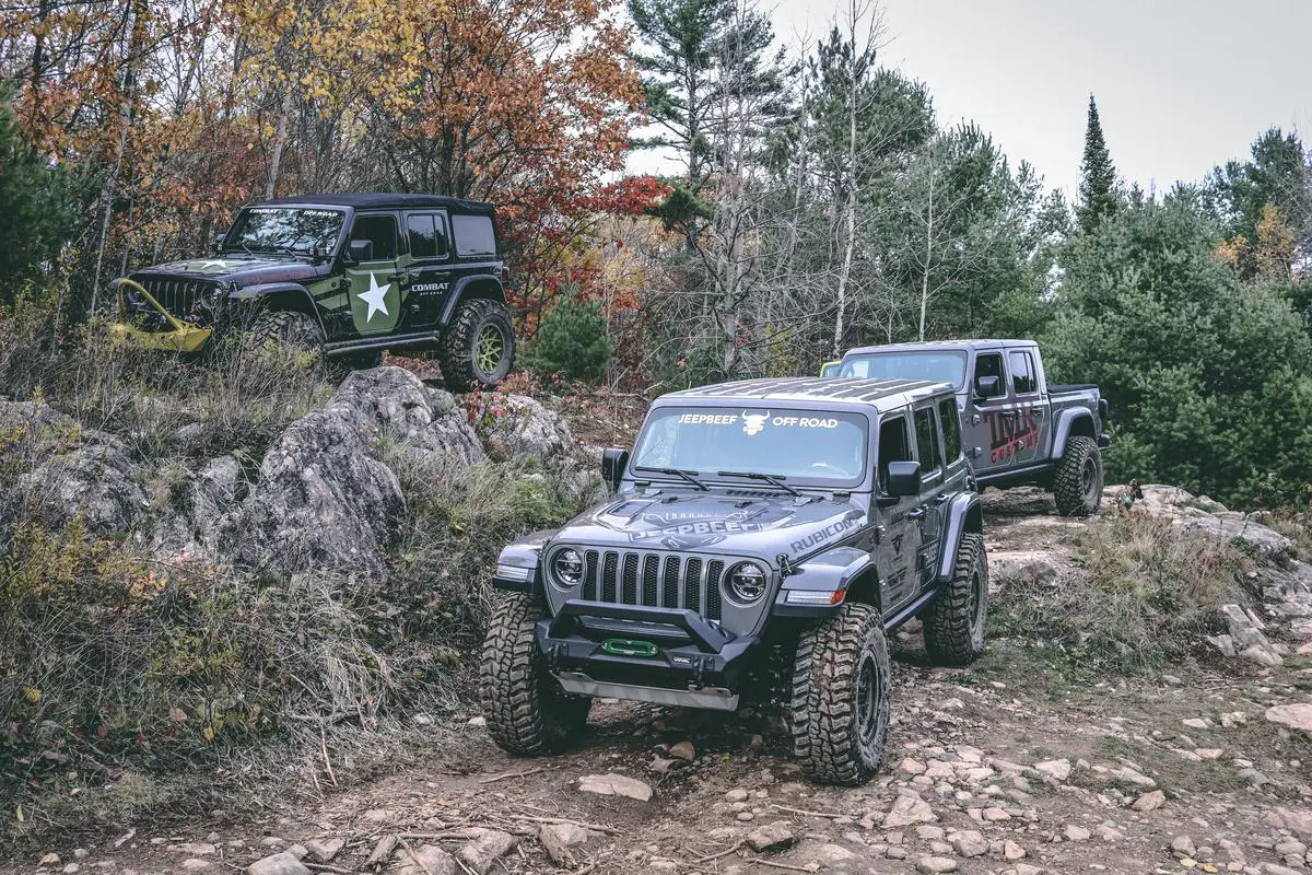 Image showcasing a Jeep off-roading on a rugged trail